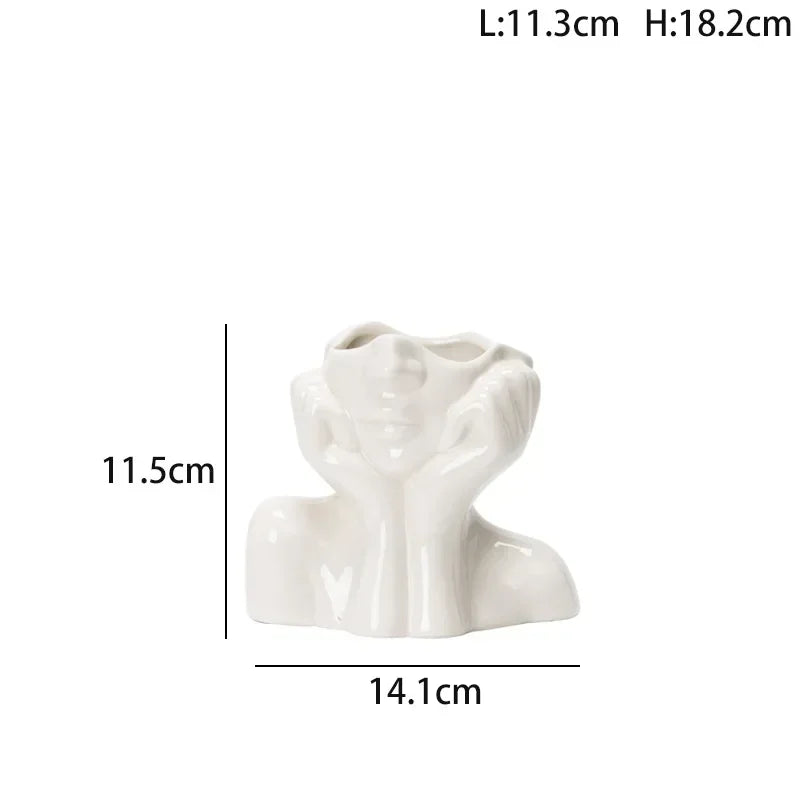 Wazon ceramiczny z motywem ludzkiej twarzy