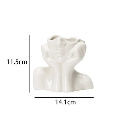 Wazon ceramiczny z motywem ludzkiej twarzy