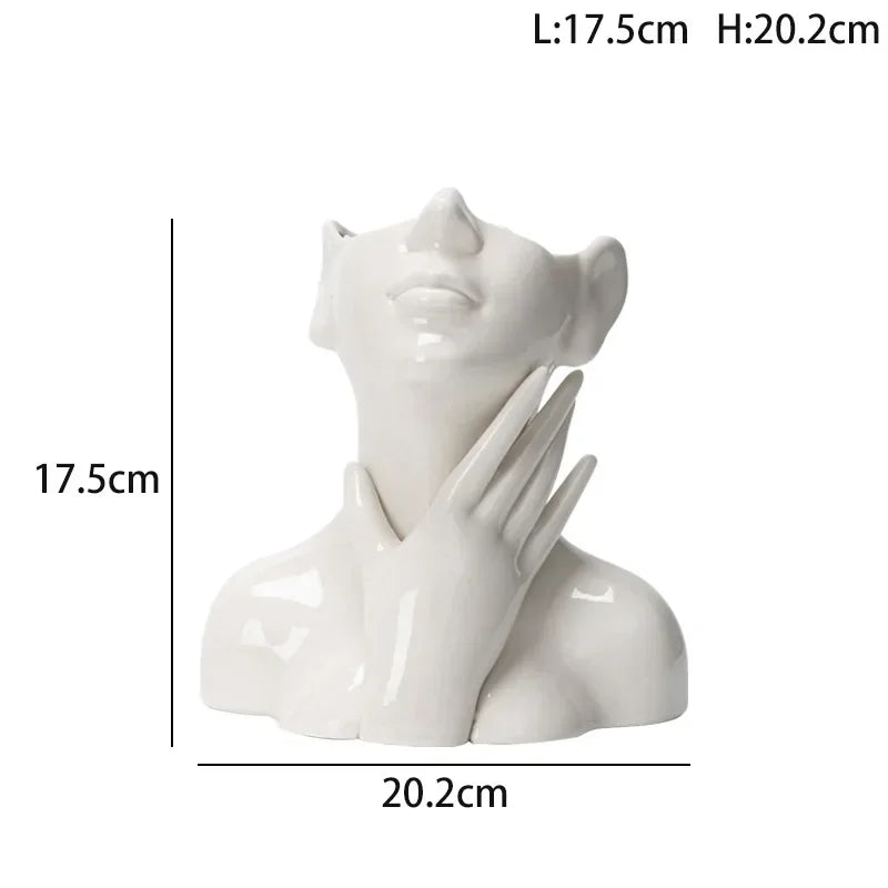 Wazon ceramiczny z motywem ludzkiej twarzy