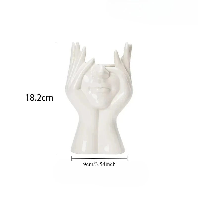 Wazon ceramiczny z motywem ludzkiej twarzy